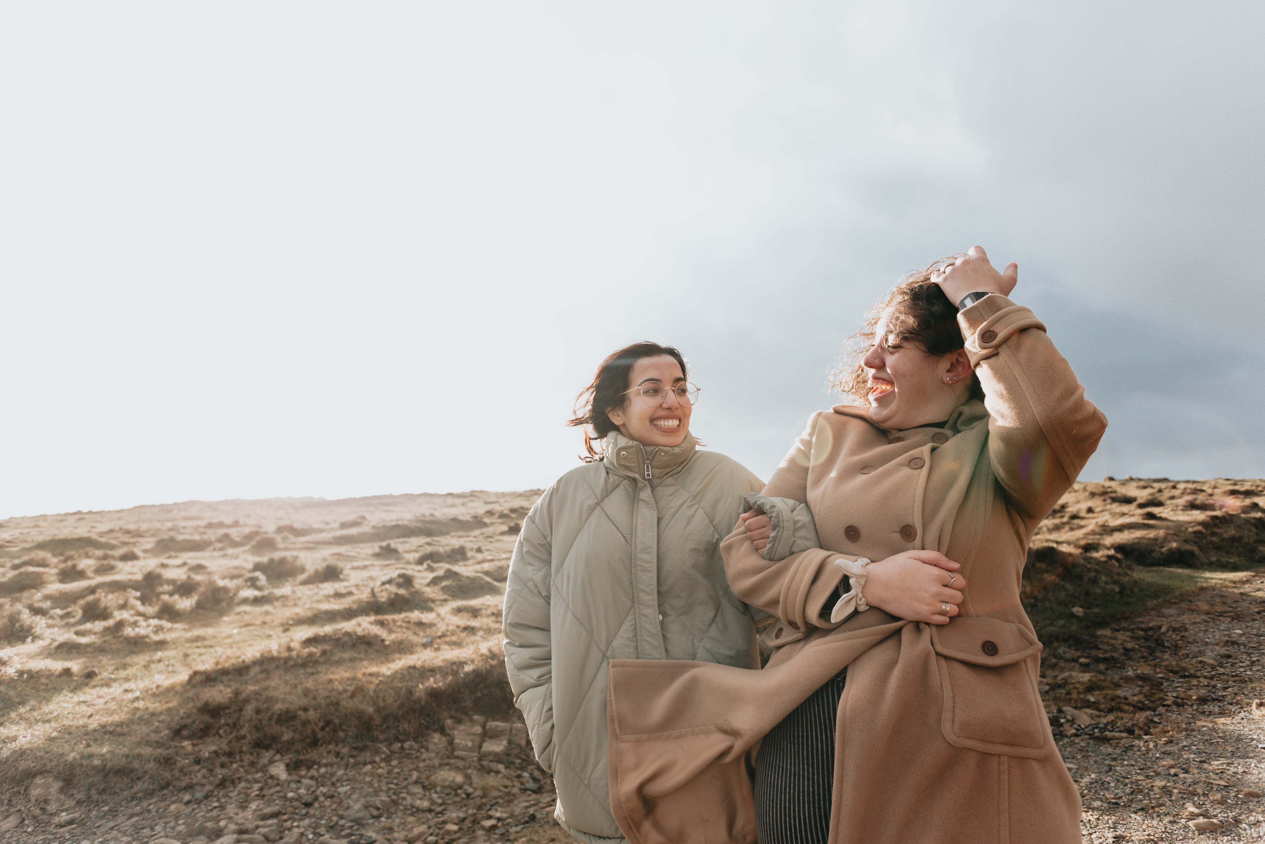 files/two-people-smile-at-each-other-while-walking-down-a-hill.jpg